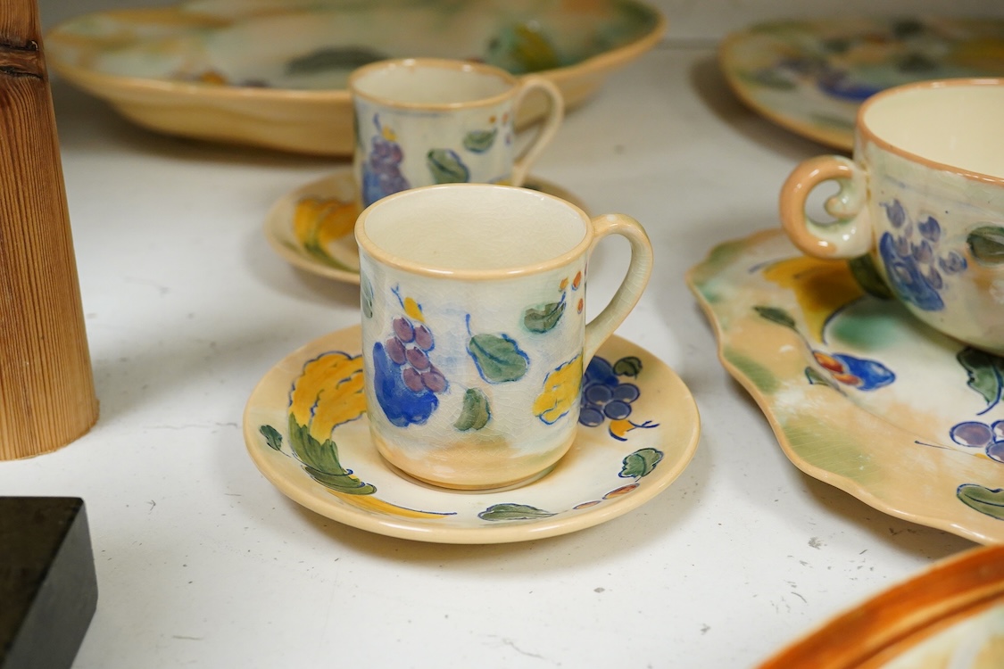 A collection of Doulton Brangwynware to include an oval dish, wall plate and two coffee cans and saucers, largest 32cm in diameter